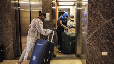 A group of women take the lift while waiting for transport to the shelter run by Caritas Lebanon. Finbar Anderson for The National