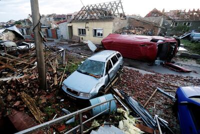 A view shows debris and damaged cars in the aftermath of a rare tornado that struck and destroyed parts of some towns, in Moravska Nova Ves village, Czech Republic. Reuters