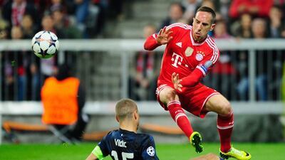 Franck Ribery, right, of Bayern Munich avoids a challenge by Nemanja Vidic of Manchester United during their Uefa Champions League quarter-final second leg match at Allianz Arena on April 9, 2014, in Munich, Germany. Lennart Preiss / Getty Images