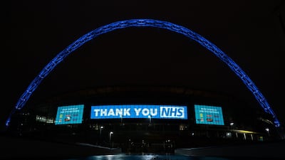 The Wembley Stadium arch in London was lit in blue to thank National Health Service staff during the coronavirus pandemic in July, 2021. PA