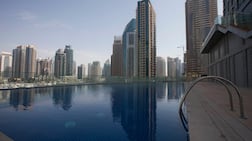 Buildings with extensive amenities, such as large landscaped areas, multiple swimming pools or concierge services, naturally cost more to operate than a simpler residential tower. Razan Alzayani / The National