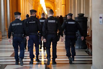 Gendarmes walk in the corridor of the hall of justice where Ayoub El Khazzani was convicted of terror charges. AP