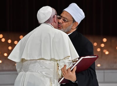 Pope Francis and Sheikh Ahmed Al Tayeb greet each other as they exchange documents during the Human Fraternity Meeting at the Founders Memorial. AFP