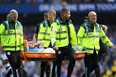 Aymeric Laporte is stretchered off the pitch during the match between Manchester City and Brighton & Hove Albion on August 31. Getty Images