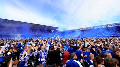 Ipswich Town supporters on the pitch after the game. Getty Images