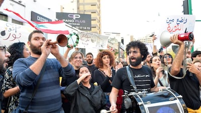 Lebanese protesters shout slogans as they march during a protest in Beirut. EPA