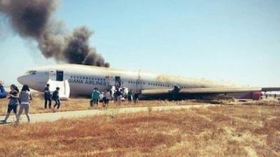 epa03778885 A photo of the Asiana Airlines passenger jet that crashed at San Francisco International Airport, San Francisco, California, USA, on 06 July 2013. The photo was taken by one of the passengers soon after he escaped from the scene. The Federal Aviation Administration said two passengers were killed and dozens of others injured. The Boeing 777 plane, which departed from Incheon International Airport near Seoul, was carrying 307 passengers and crew members, of which 77 were South Koreans, 141 Chinese and 61 Americans. The FAA said 48 people were transferred to nearby hospitals, adding the ill-fated plane may have collided with something after it landed on the runway's threshold. EPA/YONHAP SOUTH KOREA OUT *** Local Caption *** 03778885.jpg
