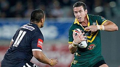 Australia's Darius Boyd, right, looks to get past New Zealand's Sija Manu at Eden Park in Auckland.