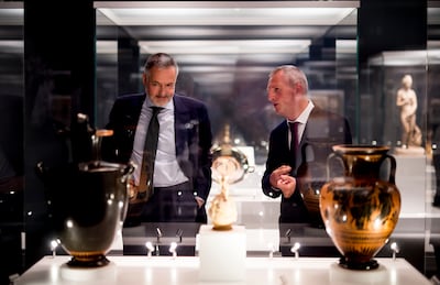 British museum director Hartwig Fischer, left, and art expert Peter Higgs at an exhibition in Madrid in July 2017. Getty Images