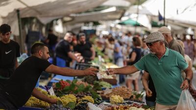Fruit stalls at a market in Istanbul. Fitch forecasts Turkey's year-end inflation at 65 per cent, compared to a 58 per cent projection from central bank governor Hafize Gaye Erkan – both up from her predecessor’s forecast of 22.3 per cent. EPA