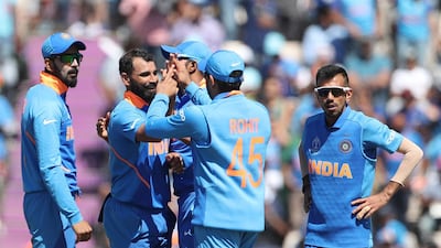 India fast bowler Mohammed Shami, second left, took a hat-trick against Afghanistan in Southampton on Saturday. Aijaz Rahi / AP Photo