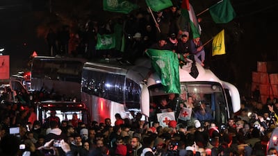 People react as a bus carrying released Palestinian prisoners from the Ofer Israeli military prison arrives in Ramallah. EPA