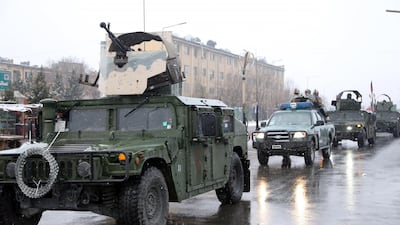 Afghan security personnel arrive at the site of an attack at the Marshal Fahim academy in Kabul, Afghanistan. Rahmat Gul / AP Photo