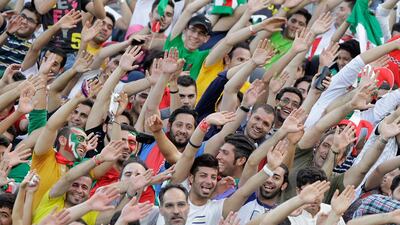 Iranian fans wave prior to start of the Iran vs Lebanon football match in the Asian qualifiers for the 2014 World Cup, at the Azadi stadium in Tehran, Iran. Vahid Salemi / AP Photo