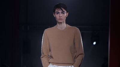 A white skirt is decorated in bridal flowers at Prada. EPA