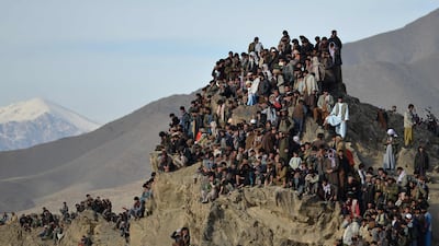 Afghans find a novel place to watch horsemen compete in the traditional sport of buzkashi. AFP