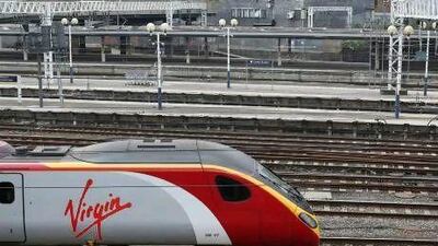 A Virgin train in London. Virgin Rail has been outbid by FirstGroup to run the West Coast Mainline franchise. Oli Scarff / Getty Images
