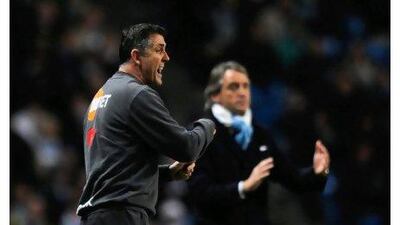Owen Coyle, the Bolton manager, hopes to get the better of Roberto Mancini today. Laurence Griffiths / Getty Images