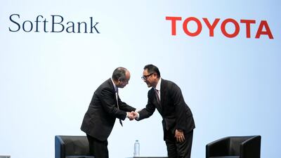 SoftBankChief Executive Officer Masayoshi Son (L) and Toyota President Akio Toyoda (R). They announced a joint venture to develop car technology. EPA