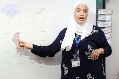 Zinab Esmaeil uses the Iqra method to teach children Arabic at RAK Academy. Chris Whiteoak / The National