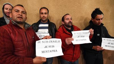 Algerian men attend a memorial gathering for Charlie Hebdo’s French proof reader of Algerian origin, Mustapha Ourrad, who was killed along with 11 others in last week’s an attack by two armed gunmen on the offices of French satirical newspaper Charlie Hebdo in Paris, on January 15, 2014 in his native village in the Kabylie region of Beni Yenni, east of Algiers. The body of Ourrad was flown from France for burial in his hometown. Farouk Batiche / AFP photo