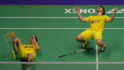 Marcus Fernaldi Gideon, right, and Kevin Sanjaya Sukamuljo of Indonesia celebrate after defeating Mads Conrad-Petersen and Mads Pieler Koiding of Denmark in the men's double final during the Yonex-Sunrise Hong Kong Open Badminton Championships 2017 in Hong Kong. Vincent Yu / AP Photo