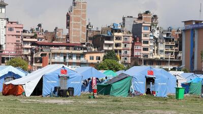 Kathmandu buildings in the background of the Tundikhel relief camp in Nepal. Pawan Singh / The National
