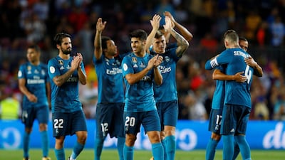 Real Madrid's players celebrate after their victory over Barcelona in the first leg of the Spanish Super Cup. Juan Medina / Reuters