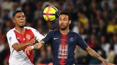 Monaco's German defender Benjamin Henrichs, left, fights for the ball with Paris Saint-Germain's Brazilian forward Neymar. AFP
