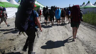 Scouts leave the site of the World Scout Jamboree in Buan, South Korea, on Tuesday. Getty Images