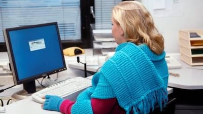 The Canadian Centre for Occupational Health and Safety says employees who work in offices that are too cold can be restless and easily distracted. Marja Airio / Rex Features