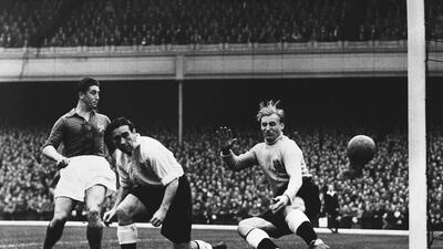 In this Oct. 3, 1951 file photo, French forward Rene Alpster beats English defender Alf Ramsey, centre, and goalkeeper Bert Williams to score France's second goal in the England - France International soccer match at London's Highbury Stadium, which ended in a 2-2 draw. Now aged 90, Williams was the goalkeeper who conceded the only goal of the game when a team of journeymen Americans beat a talented England side in Brazil in 1950, one of the biggest upsets in World Cup history(AP Photo)