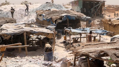 Small-scale gold miners at work in Bouda, Burkina Faso on February 23, 2020. A growing number of miners are out of work as militants try to seize control of the country's most lucrative industry. AP Photo