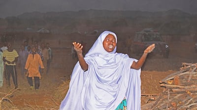 A woman pleads for the rescue of schoolchildren who were kidnapped by gunmen in Nigeria's Kaduna state on Thursday. AP Photo