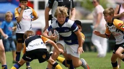 Jess's Findley Ratcliff finds running room during action in the Under 12 category at the Middle East Schools Rugby Union International Festival.
