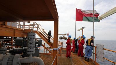 The Omani flag flies over the Bukha A oilfield off the sultanate’s shores. Pawan Singh / The National