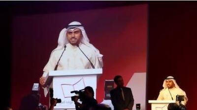 Saud Alsanousi speaks after winning the International Prize for Arabic Fiction in Abu Dhabi on Tuesday. Pawan Singh / The National