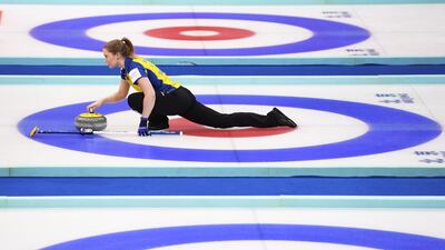 Sweden’s Sara McManus releases the stone during their bronze medal match against Scotland at the Women’s Curling World Championships in Beijing. Greg Baker / AFP