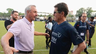Johan Cruyff, coach of Team YR1M, and Fabio Capello, coach of Team Laureus, in discussion during the Laureus All Stars Unity Cup on Tuesday. Mike Hewitt / Getty Images