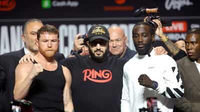 Undisputed super middleweight champion Saul 'Canelo' Alvarez, left, and Terence Crawford pose with Turki Alalshikh, centre, the Saudi power broker now de facto running world boxing, during a news conference at T-Mobile Arena on September 11, 2025 in Las Vegas, Nevada. AFP