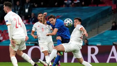 Italy's Federico Chiesa scores their first goal.