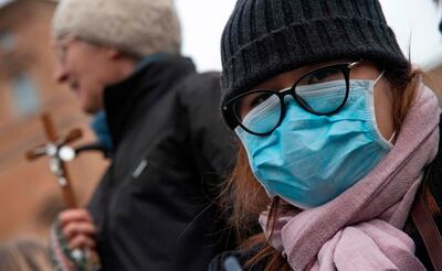 Catholic faithful wear face masks in St Peter's Square. AFP