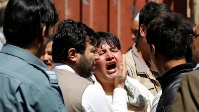 A man reacts as others comfort him at the site of a suicide attack in Kabul, Afghanistan on April 22, 2018. Omar Sobhani / Reuters