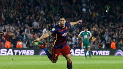 Barcelona’s Luis Suarez celebrates his second goal against Eibar on Sunday in La Liga. Albert Gea / Reuters