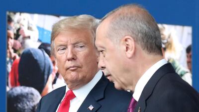In this July 11, 2018 file photo, US President Donald Trump, left, talks to Turkish President Recep Tayyip Erdogan as they tour the new Nato headquarters in Brussels, Belgium. AP