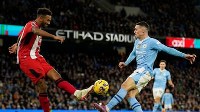 Kept City's forwards at arm's length for most of the first half, as the visitors proved hard to break down and the home side were restricted to shooting from long range. Vital block to deny Foden in second half. Bailed out his keeper in stoppage time. AP