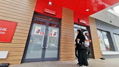 A Saudi woman walks towards the 'family section' while a man comes out of the 'single section' at a McDonald's outlet in Khobar, Saudi Arabia. Reuters