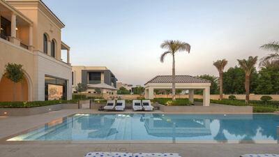 The villa looks out to the near-by golf course.. Courtesy Luxhabitat Sotheby's International Realty