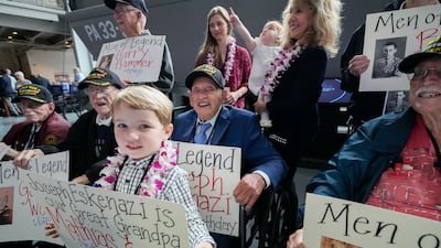 Mr Eskenazi with fellow veterans, his great-grandchildren and their grandmother, Belinda Mastrangelo