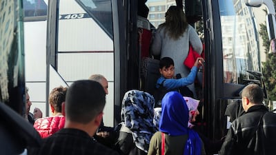 Syrian refugees prepare to return to their homelands of Jarablus, Damascus, Aleppo, A'zaz, Al Bab and Afrin in Syria. Here they are seen loading their belongings onto buses and waiting to depart from Esenyurt Municipality garden in Istanbul, Turkey, on November 9, 2019. Emrah Gurel for The National